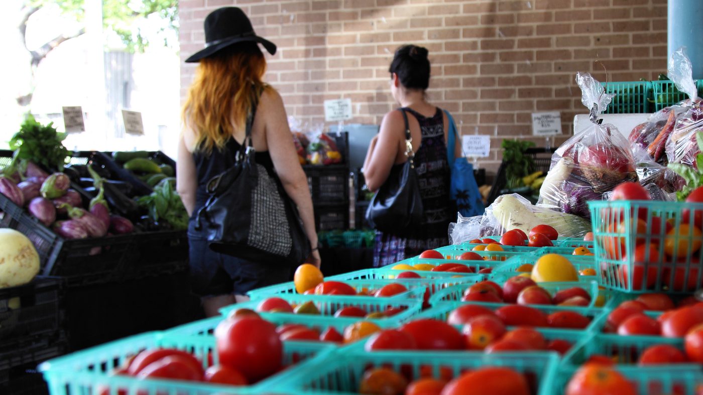 Crates of tomatoes on a market table in Austin